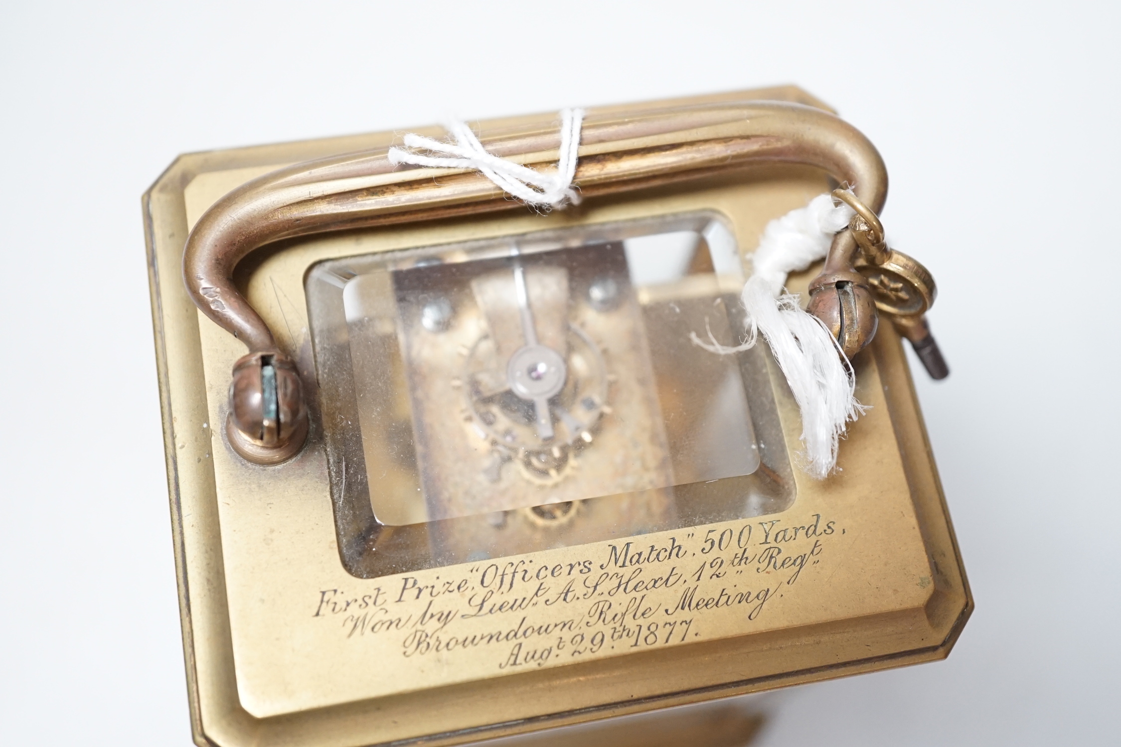 A French brass carriage timepiece, 16.5cm high to handle